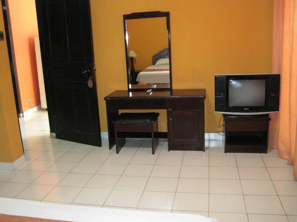 Sekar Sari Inn Кута Стая снимка